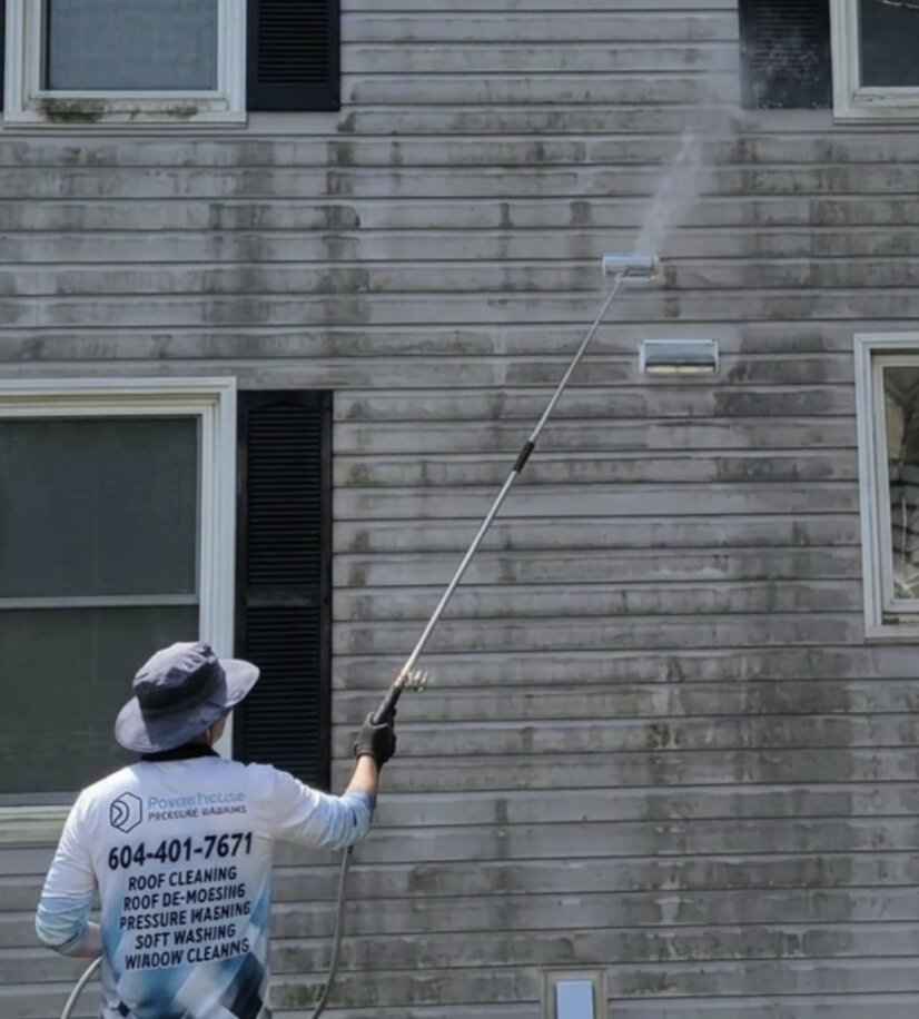 Powerhouse Pressure Washing crew cleaning a townhouse corner in Walnut Grove, Langley